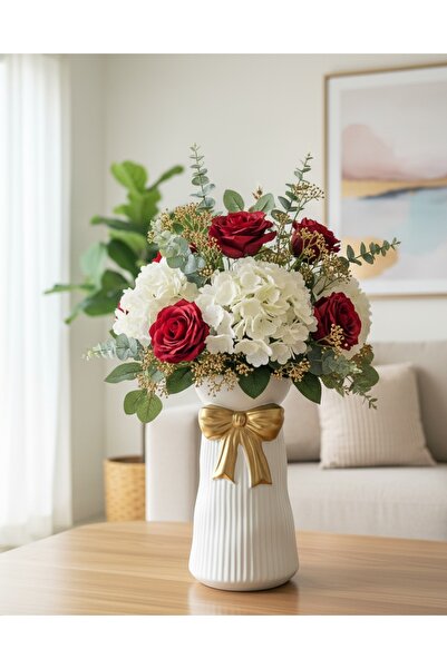 Generic A shiny gold rose vase - a sophisticated decorative piece that fits any space. Comes without the roses.