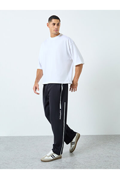 Styli Men Black Slogan Print Oversized Joggers