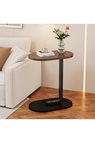 Chuma The C-shaped sofa side table and sofa TV tray table feature metal frames.