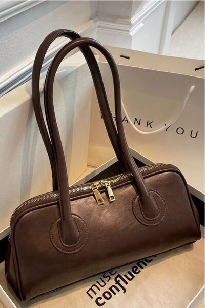 Nudia حقيبة يد وحقيبة كتف موديل باجيت بمقبض طويل من مونرا