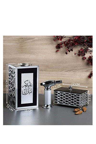 Story of candle An incense burner with a box for storing incense, bearing the phrase "Eid Mubarak," along with Maroki oud and a luxury lighter.