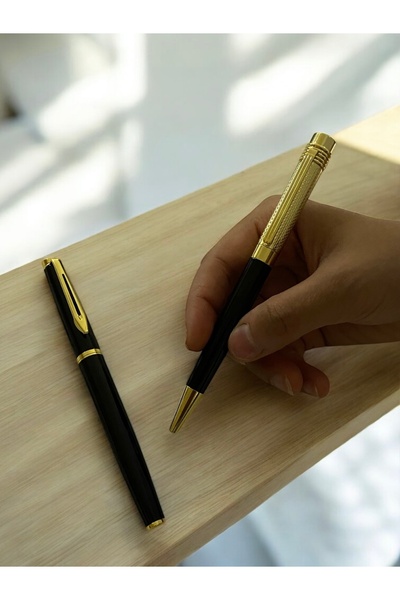 NEW STYLE A luxurious and elegant pen set consisting of a ballpoint pen and a fountain pen, presented in a stylish gift box.