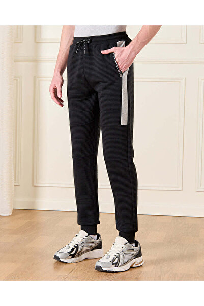 REDTAG بنطال رياضي أسود مضلع للأولاد الكبار