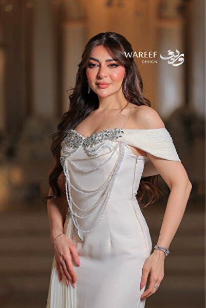 WAREEF FASHION Long Cream Crepe Evening Dress - A-Line Off-Shoulder with Silky Pleats & Hand Embroidery