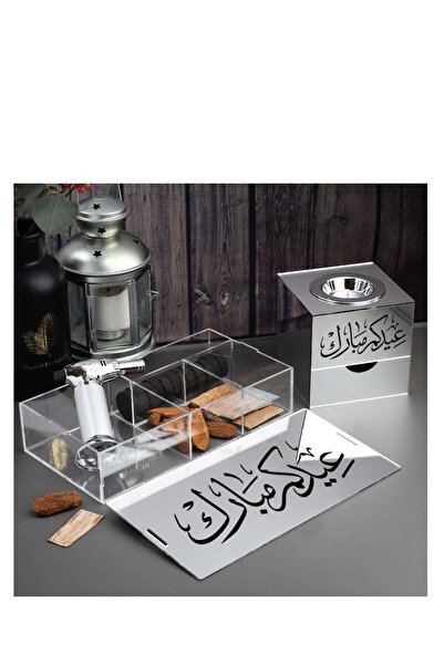 Story of candle Incense burner with a box for storing incense, bearing the phrase "Eid Mubarak," along with Maroki and Vietnamese oud, a lighter, and charcoal.