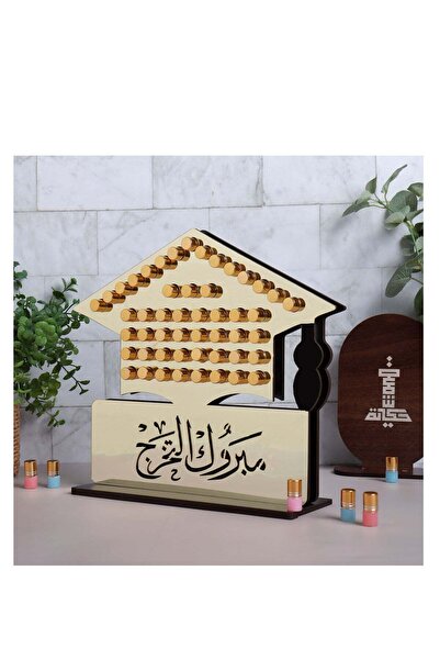 Story of candle استاند 50 حبة مسك فاخر (شكل تخرج) عليه عبارة مبروك التخرج