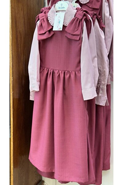 La reina petite Pink elementary school uniform with a striped shirt and bows on the shoulder