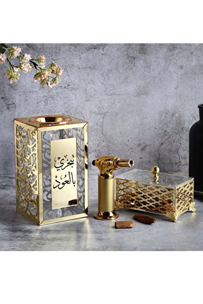 Story of candle An incense burner with a box for storing incense, bearing the phrase "Burn with oud," along with Maroki oud and a luxury lighter.