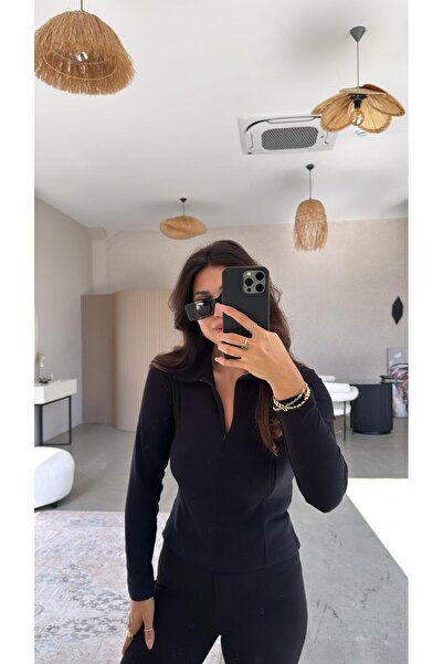 Buket Teke بلوزة مودال بياقة بسحاب باللون الأسود