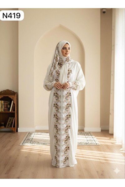 STAYILK DRESSES Elegant prayer robe in a soft pink color, with a modest and comfortable design adorned with lace.
