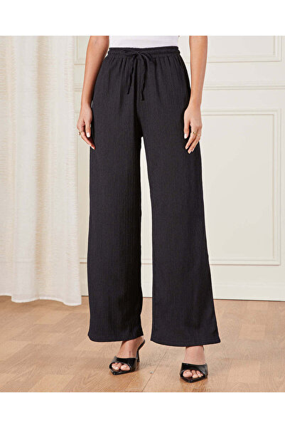 REDTAG بنطلون نسائي أسود منقوش سهل الارتداء