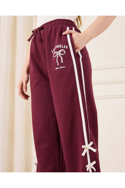 REDTAG طقم ملابس رياضية بطبعة فيونكة باللون العنابي للفتيات الكبيرات (قطعتان)