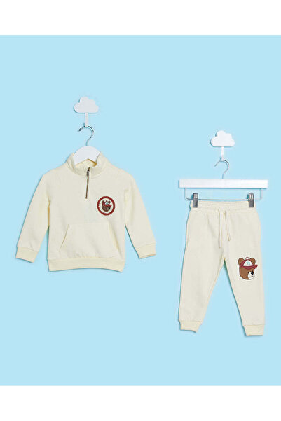 REDTAG طقم بدلة جري بنصف سحاب للأولاد الرضع باللون الكريمي (قطعتان)