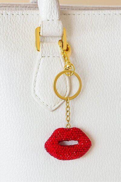TAKIŞTIR حقيبة/سلسلة مفاتيح بتصميم شكل الشفاه باللونين الذهبي والأحمر مع تفاصيل حجرية