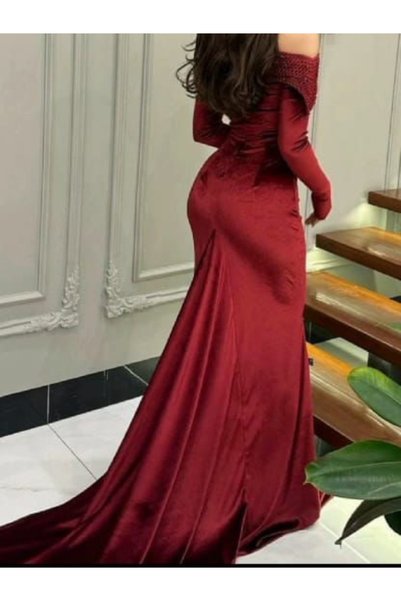 Nice Model Off-the-shoulder velvet evening gown with a shimmering mesh bodice and long sleeves; a formal dress.