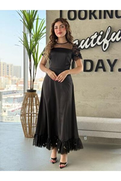 Aljouri Dress with transparent sleeves and ruffled-trimmed edges