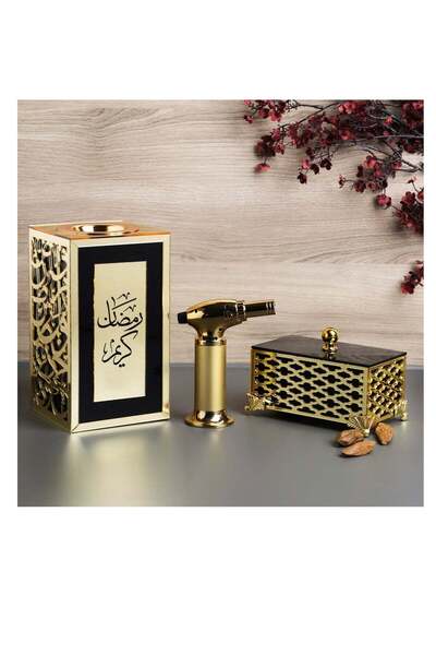 Story of candle An incense burner with a box for storing incense, bearing the phrase "Ramadan Kareem," along with a piece of Maroki oud and a luxury lighter.