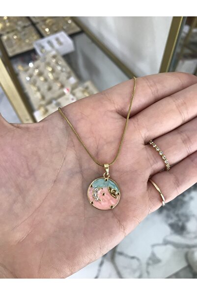 the ASEL İNCİ قلادة فنية من الفولاذ بتصميم الكوكب