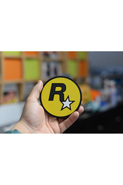 Fabrion قاعدة أكواب بشعار Rockstar Games - تصميم خاص لعشاق الألعاب ومحبي الألعاب