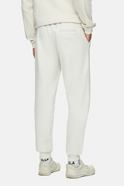 UCLA Ανδρικό παντελόνι αθλητικής φόρμας MADOC Bone Color με ελαστικό πόδι με τύπωμα Standard Fit