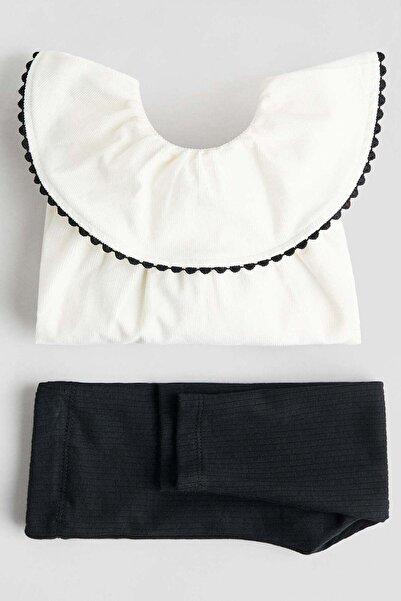 H&M طقم مكون من قطعتين بلوزة وبنطال ضيق