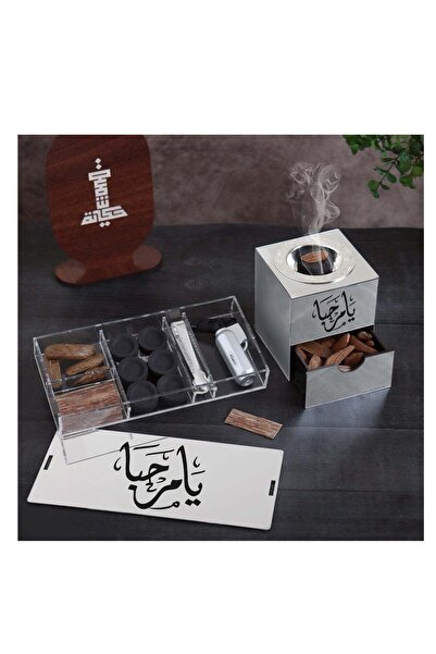Story of candle Incense burner with a box for storing incense and for the incense itself, bearing the phrase "Ya Marhaba" (Welcome), along with Maroki oud, Vietnamese oud chips, a lighter, and charcoal.