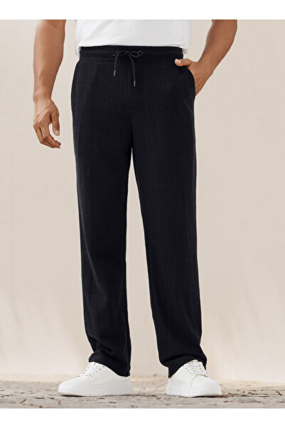 Iconic بنطلون بقصّة عادية ومزخرف مع جيوب