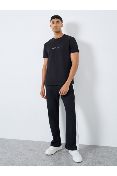 Styli Men Black Slogan Print Oversized Joggers