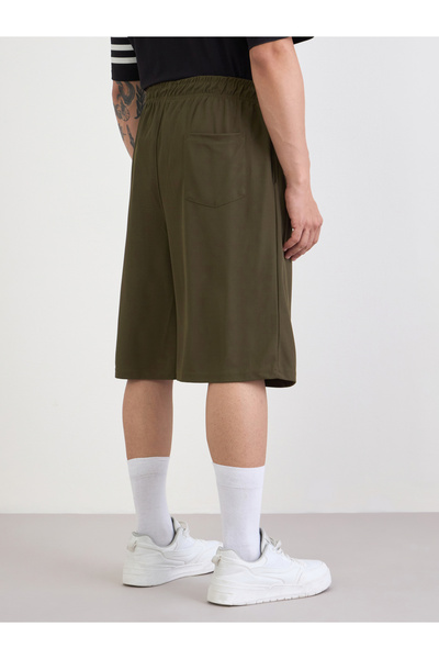 Styli Micro Pique Knit Reflective Logo Oversized Training Shorts