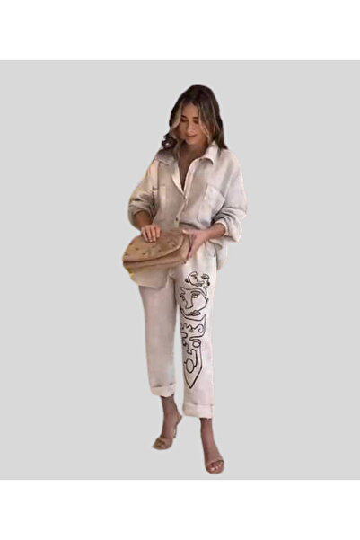 MQ Elegant women's set: long-sleeved shirt and long pants with a leg print.