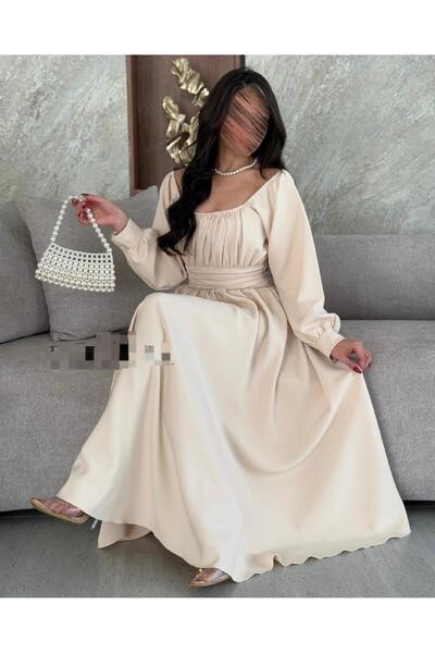 Narin Elegant beige dress with a soft design and long sleeves, perfect for special occasions.