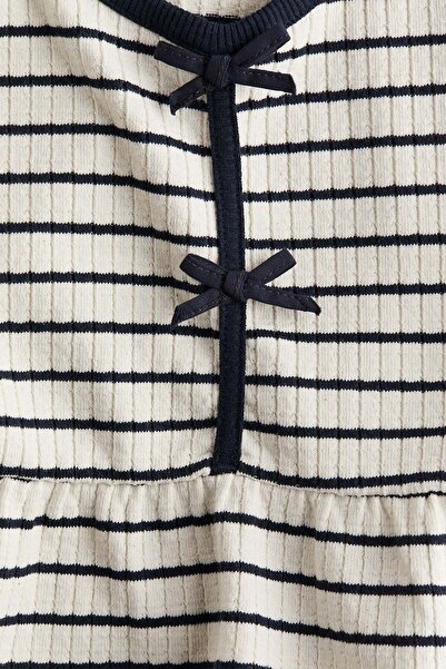 H&M بلوزة ببلوم محبوكة