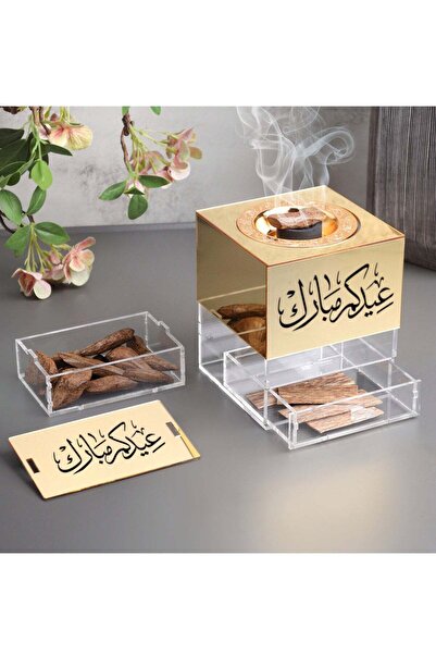 Story of candle Incense burner with a box of incense bearing the phrase "Eid Mubarak" and Moroccan oud, made of glossy, transparent acrylic.