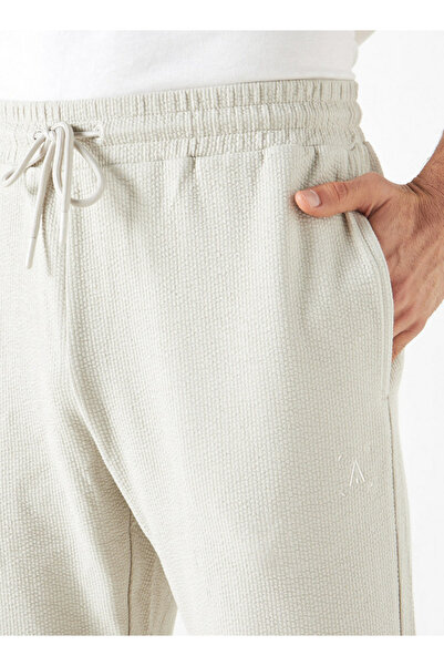 Adot Textured Joggers with Drawstring Closure and Pockets