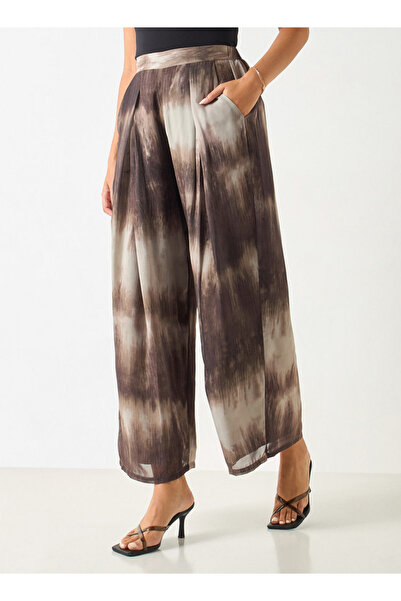 Iconic بنطال واسع الساق بطباعة كاملة مع حزام خصر مطاطي جزئيًا