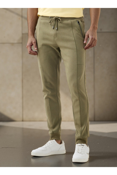 Iconic بنطال رياضي بقصّة Slim Fit مع رباط إغلاق وجيوب