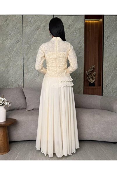 Lafrose boutique A royal white evening gown with exquisite embroidery and a flowing silhouette – a luxurious and elegant design.