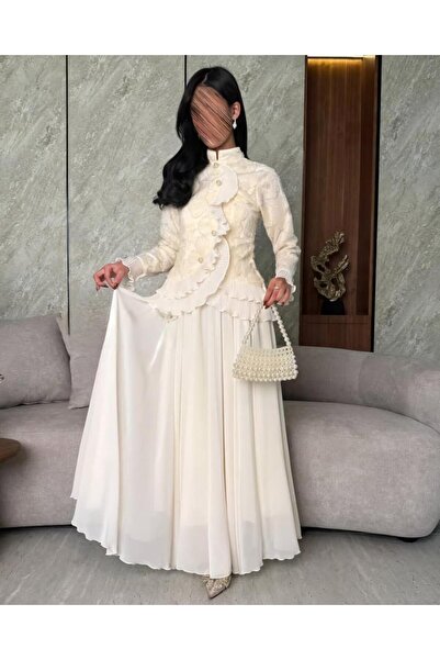 Najd Fashion A royal white evening gown with exquisite embroidery and a flowing silhouette – a luxurious and elegant design.