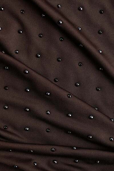 H&M بنطلون جيرسي مزين بأحجار الراين