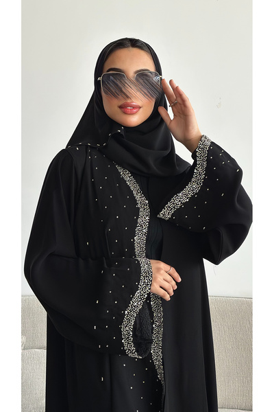 outline A black abaya adorned with elegant wavy beading