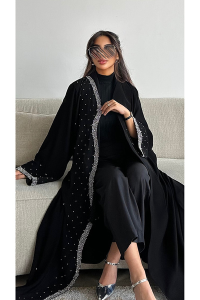outline A black abaya adorned with elegant wavy beading