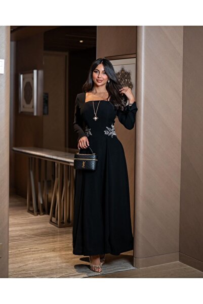 Heidi Black dress with embroidered detailing at the waist