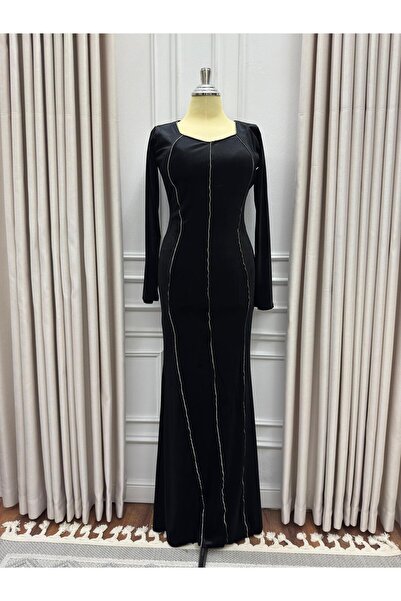 Heidi Black velvet dress adorned with an extended accessory