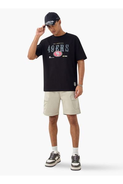 SP Characters تي شيرت NFL مطبوع برقبة دائرية وأكمام قصيرة