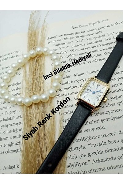 QUARTZ ساعة عتيقة الطراز بتصميم بسيط وحزام أسود مع أرقام رومانية