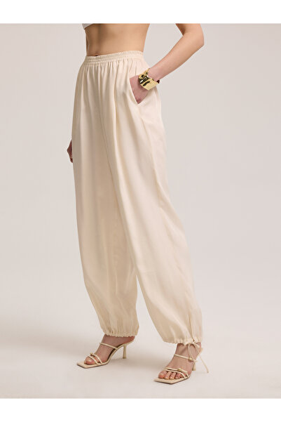 BAQA Open Beige Trousers with Lace-up Cuffs