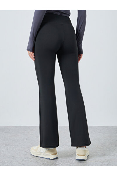 Styli Women Black Solid Plain Flared Leggings