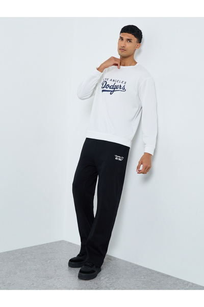 Styli Men Black Slogan Print Oversized Joggers