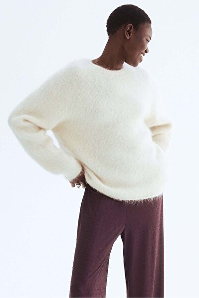 H&M بنطلون جيرسي مزين بأحجار الراين