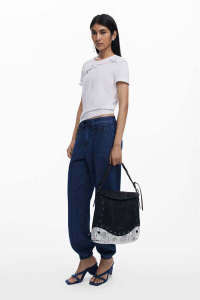 Desi Medium convertible backpack with snake pattern